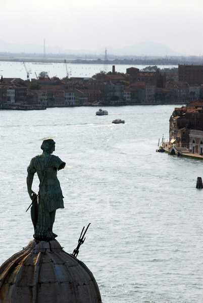 The statue of St. George on top of the dome of San Giorgio Maggiore with the Canale della Giudecca