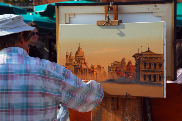 Sidewalk painter at work in Venice
