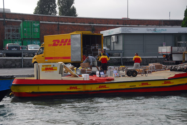 Motor vehicles don't get past Piazzale Roma, here a DHL truck unloading on to a DHL motorboat for delivery