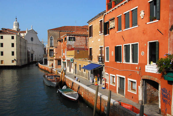 Sotoporte dei Guardiani with the white faade of the Church dell'Anzolo Rafael on the Rio Angelo Raffaele, Venice