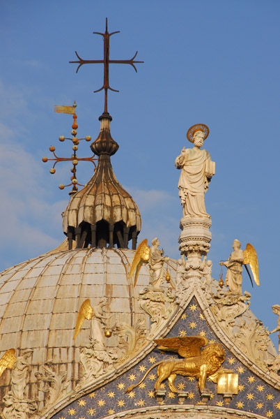 Cross on top of the main dome with the statue of St. Mark