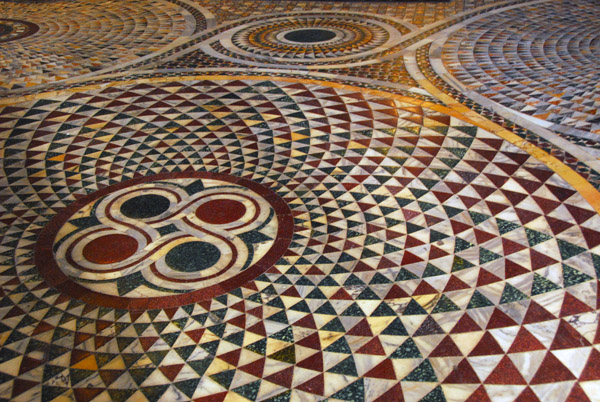 Opus sectile floor tile tecnique using red porphiry and green serpentine between the north transept and main nave