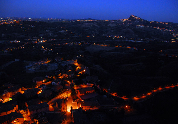 Lights of the village of Torriana with San Marino in the distance