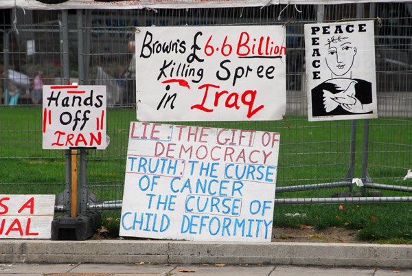Middle East protest posters in front of Parliament, London