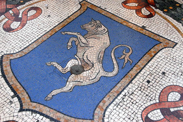Famous mosaic bull of Turin - people spin their heels in the hole for luck, Milan Galleria