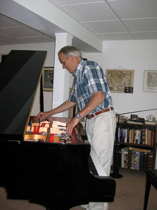 A month later John arrives to tune the piano