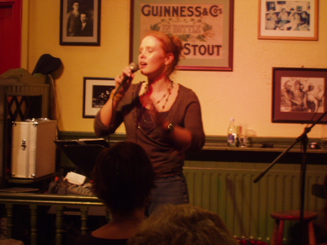 A stirring ballad, a cappella, by a member of the audience