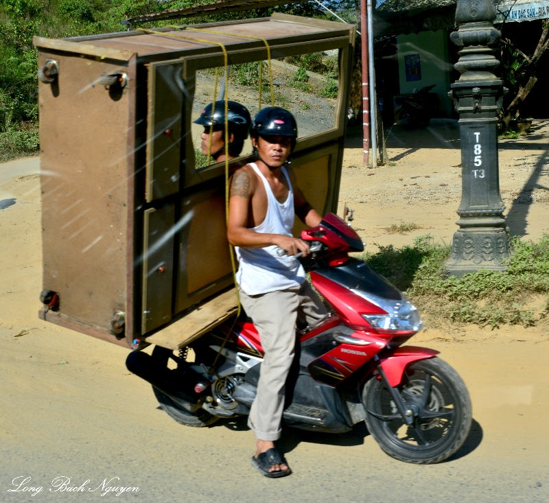 large chest on scooter, Au Co road, Huong Phuoc, Vietnam 