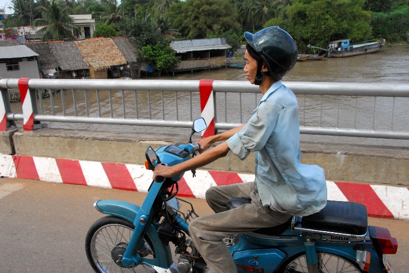 smiling skinny scooter driver