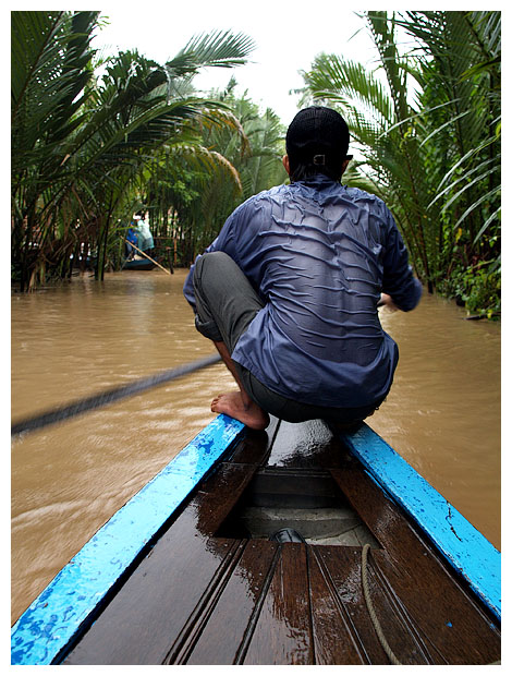 Boatman in the rain