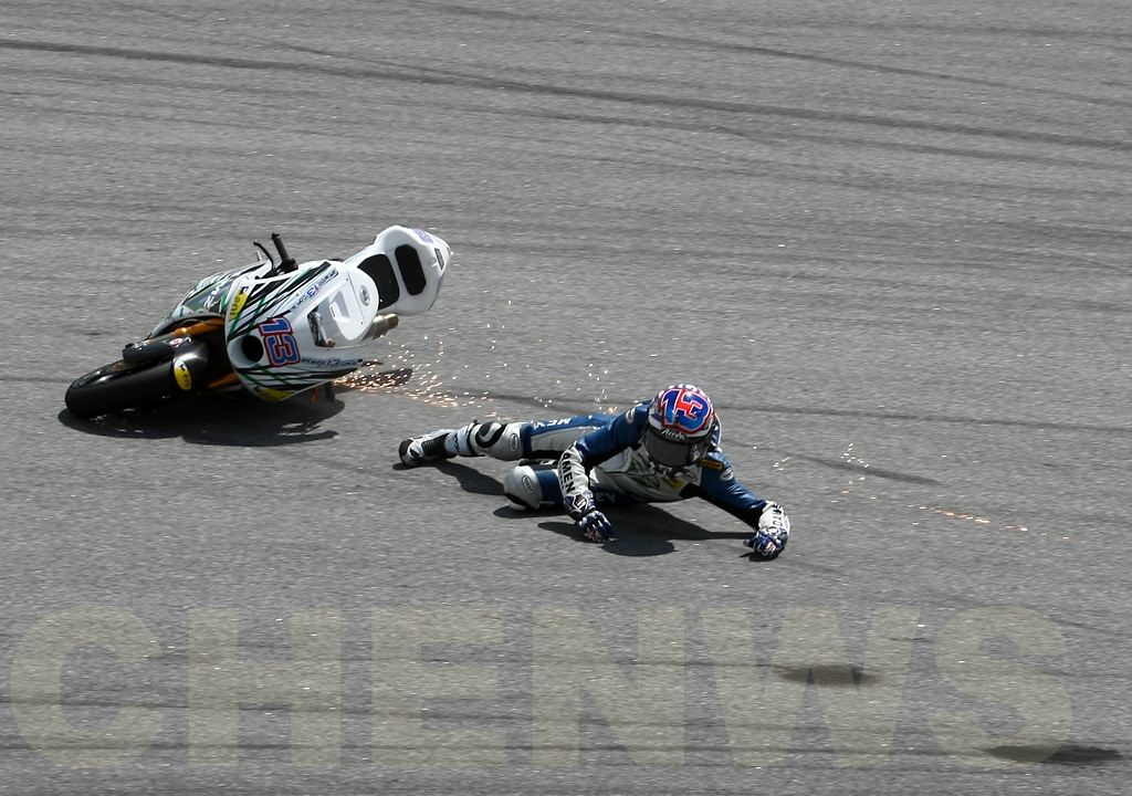 Anthony West (Moto2) falls during practice at the Malaysian Motocycle GP 2011