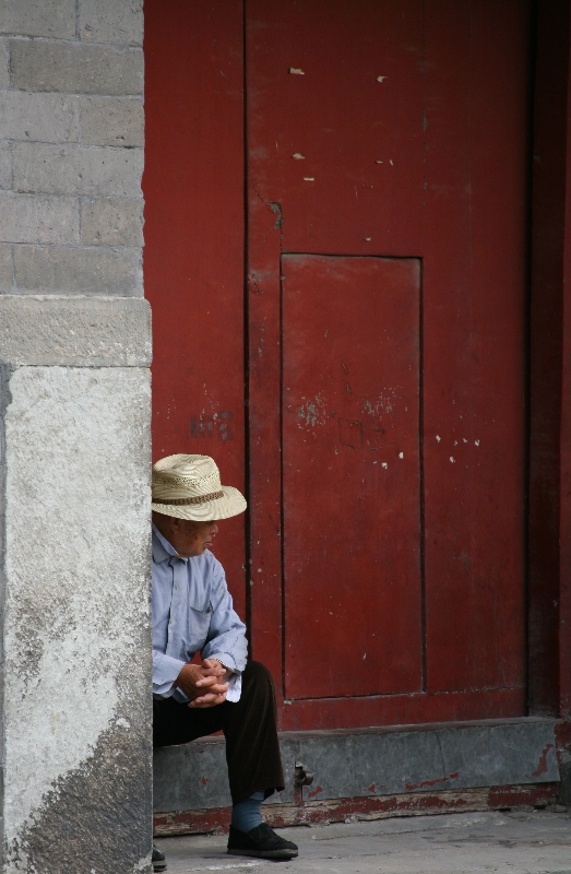 Man and red door at the Bell Tower