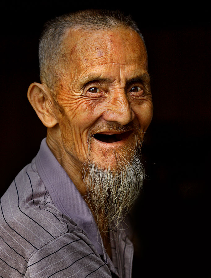 Kam elder, the father of the village leader.
