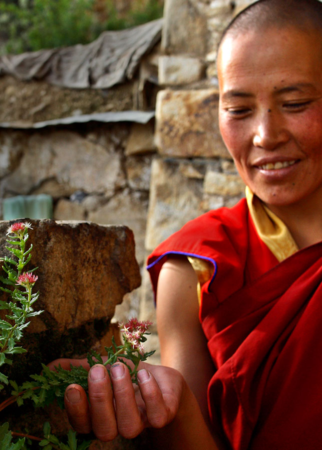Ani (nun) near her high mountain homes near Lhasa, Tibet.