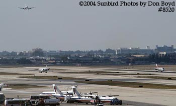View of MIA's airfield with NW DC9-31 N8950E taking off airline aviation stock photo #8520