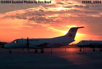 Corporate Air's EMB-120ER N218AS and Phoenix Air Group's G-159 N184PA on the ramp at sunset aviation stock photo #2685