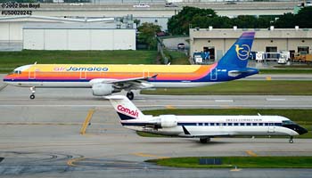 Delta Connection (Comair) CL-600-2B19 N967CA and Air Jamaica A321 6Y-JMD airline aviation stock photo