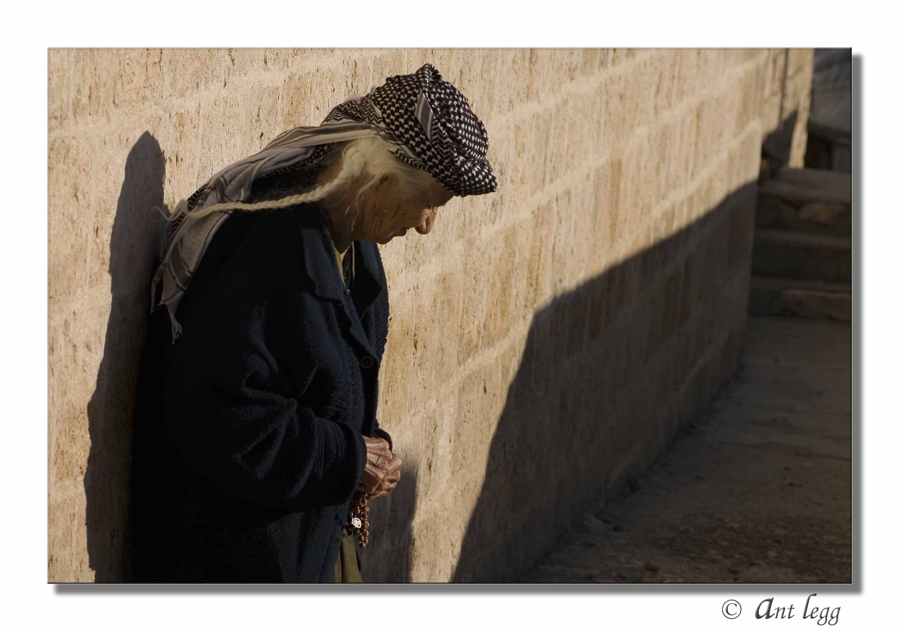 Praying with her beads