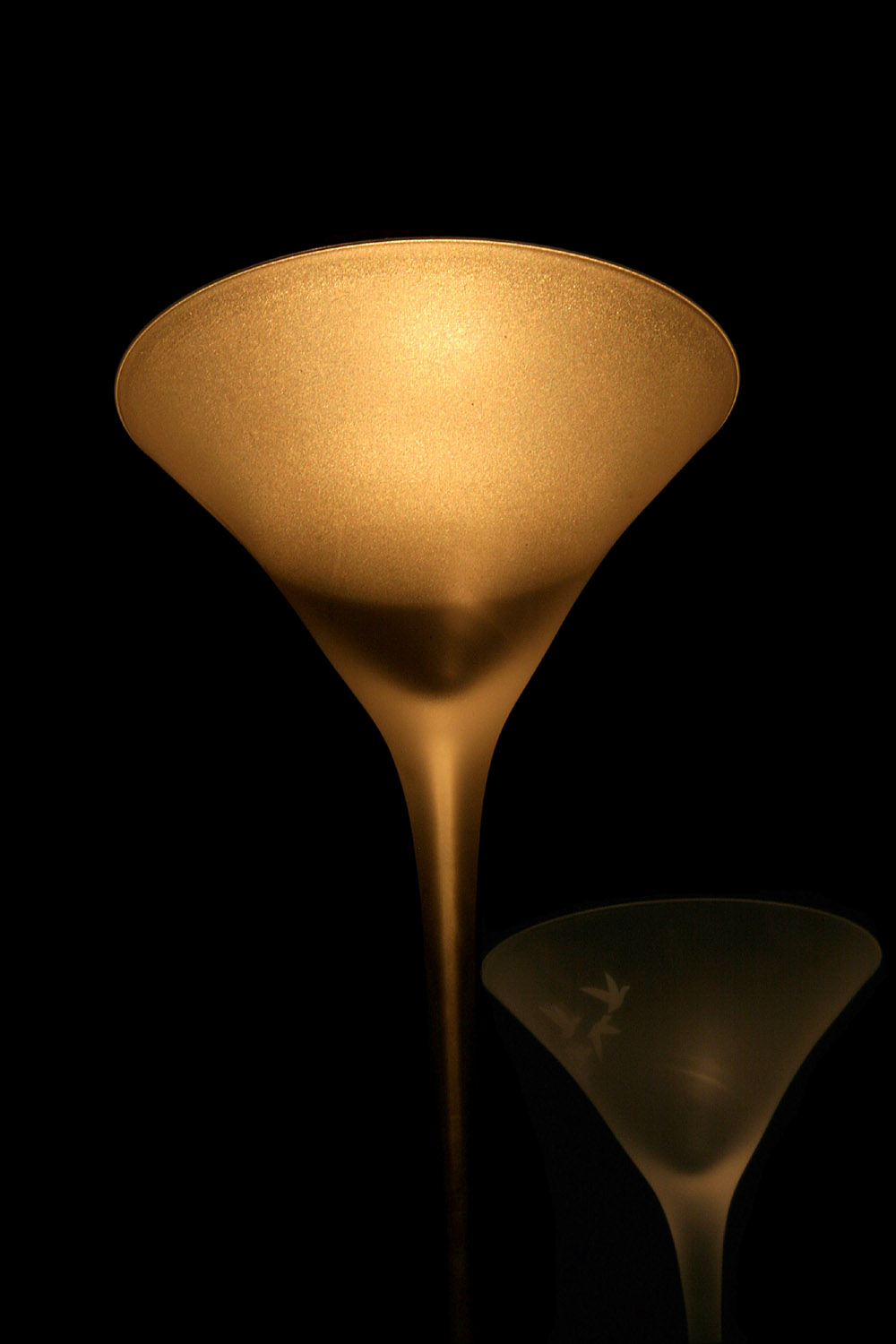 A Glass and its Reflection in the China Cabinet Mirror  *
