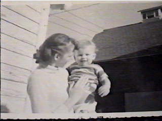 Opies sister Bobby holding Jerry at house on Farmington Road.jpg