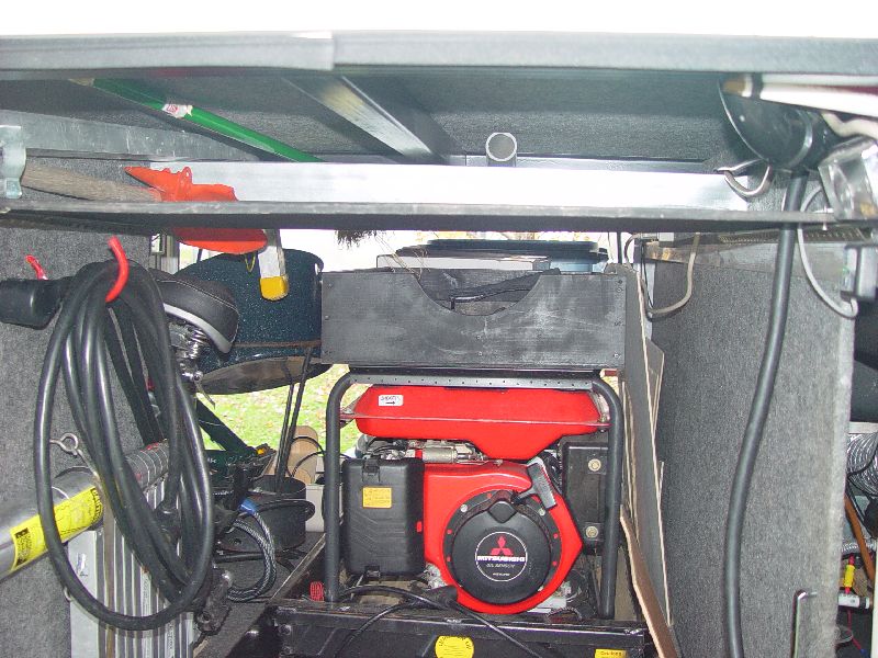 CUSTOM BUILT SHELVES ABOVE THE GENERATOR TO STORE THE HOSES FOR EASY ACCESS