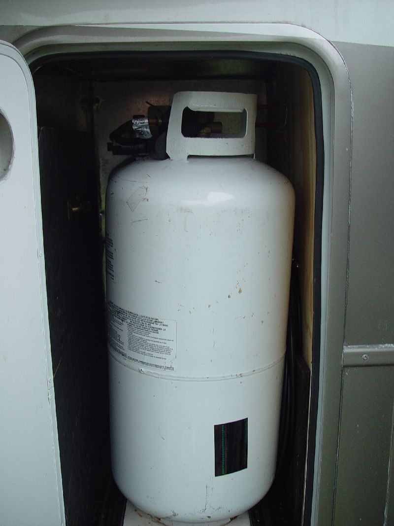 2 40 LB PROPANE TANKS AND THE SATELLITE DISH EQUIPMENT
