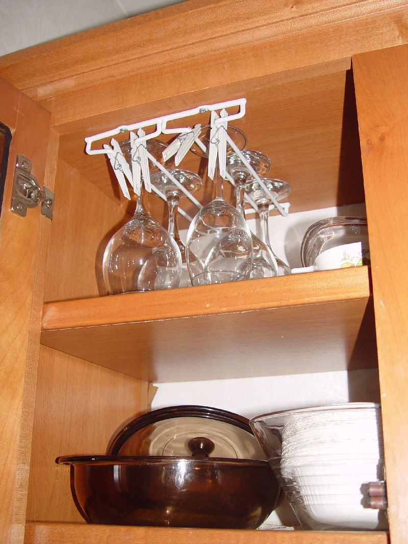 WINE RACK WITH CLOTHES PINS TO HOLD IN PLACE