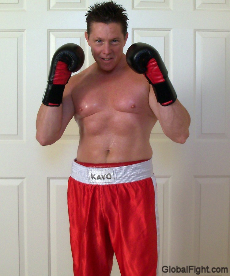 man in boxing gloves sweaty man sweating.jpg