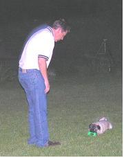 Steve and our grandpuppy, Buster with a toy from the spa. Give it up, Buster.JPG