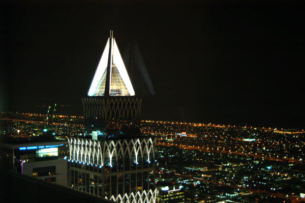 Top of Union Property (U.P.) Tower at night from Emirates Towers hotel