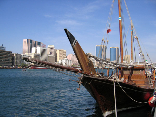 Traditional wooden dhow tied up along Dubai Creek