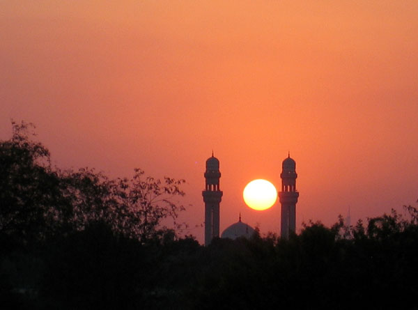 Minarets of a mosque on Al Ain Road at sunset