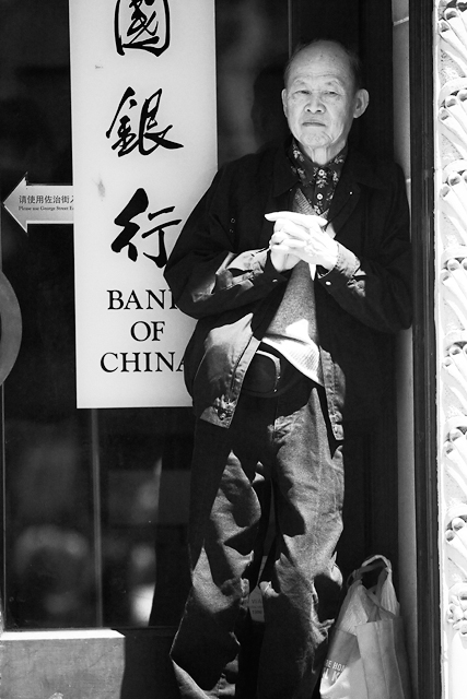 Man in doorway in Chinatown 