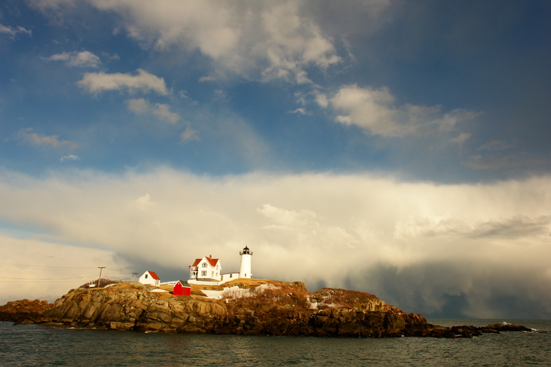 100DSC03437.jpg SNOW SQUALL AND DISTANT WATER SPOUT AT NUBBLE LIGHTHOUSE... lighter than adj one