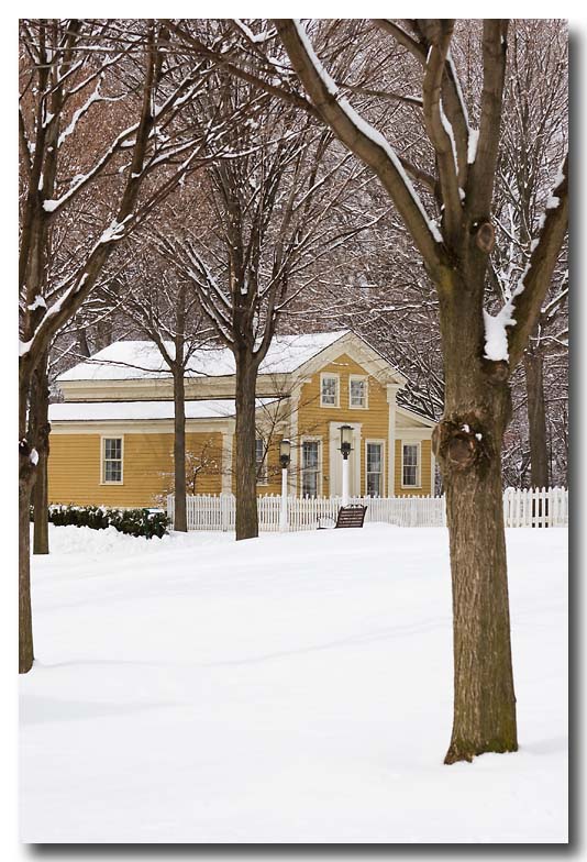 Yellow house in snow