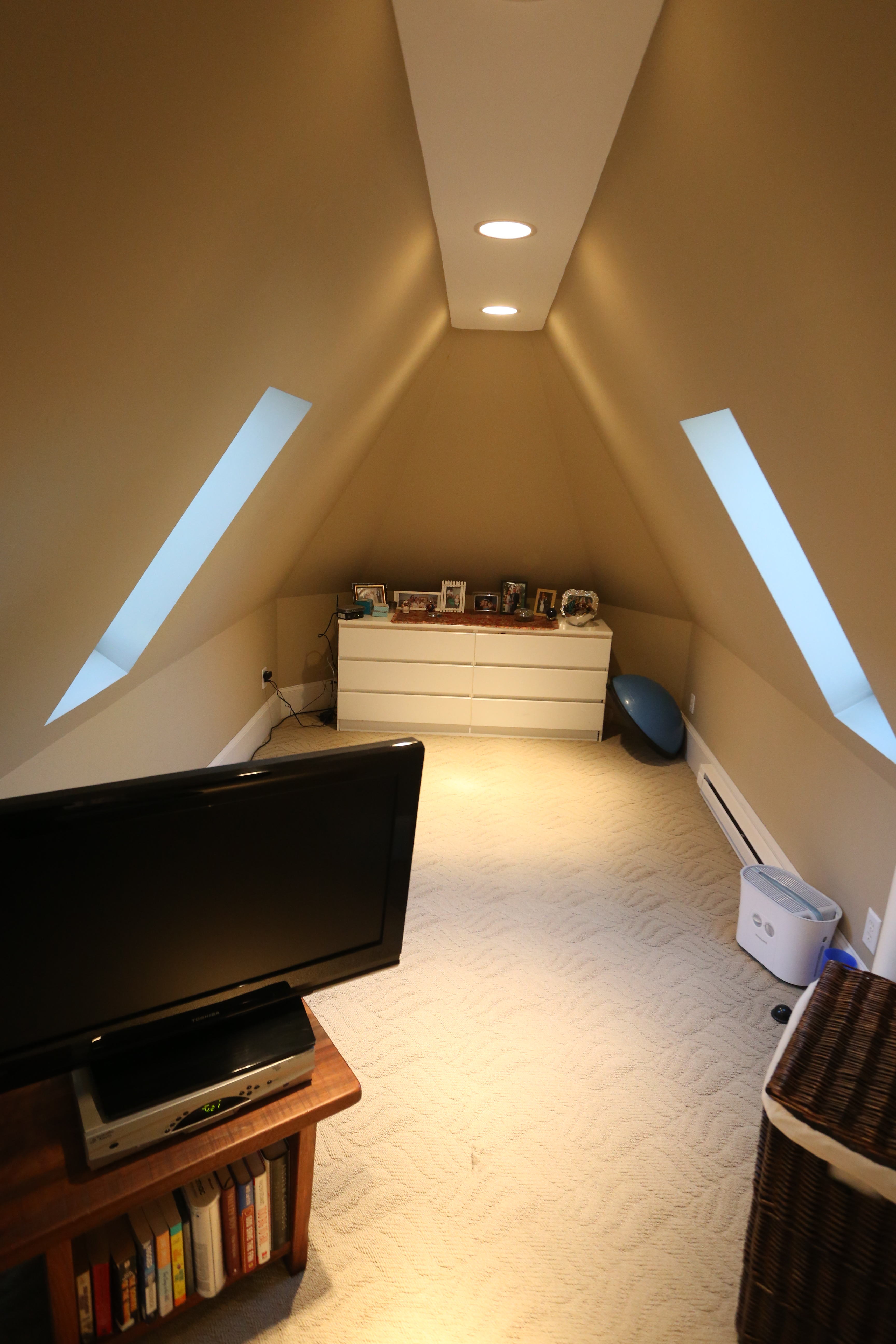 third floor suite other room with skylights