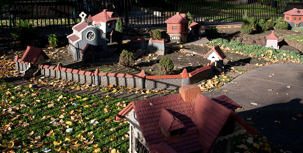 18173 09:33 Day 2 - The Mock Tudor Village II, Long Shadows Over The Churchyard