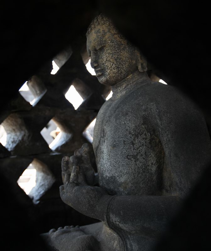Buddha in a Stupa at Borobudur