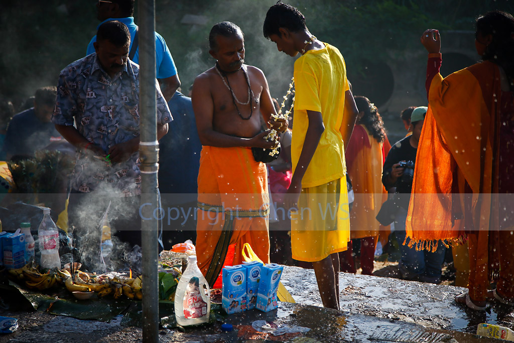 Cleansing ceremony on the river bank