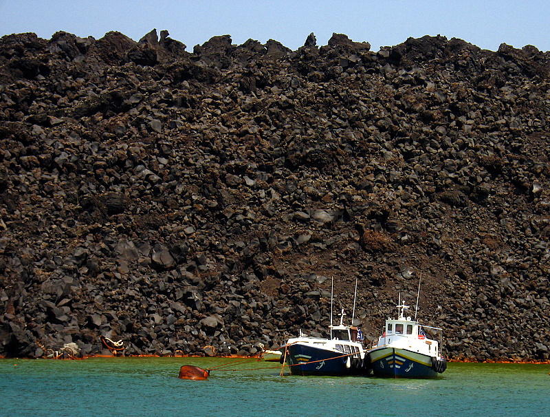 Fishing boats beside the Santorini Volcano