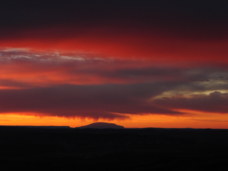 Sunrise over distant mountains*