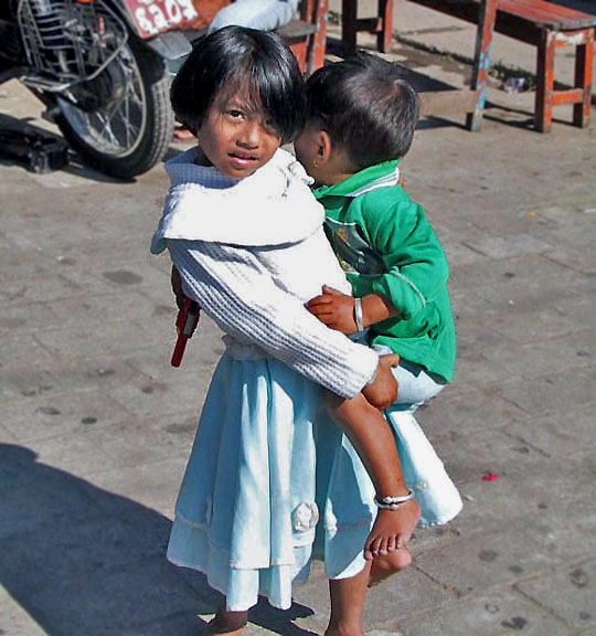 Sister holding her brother