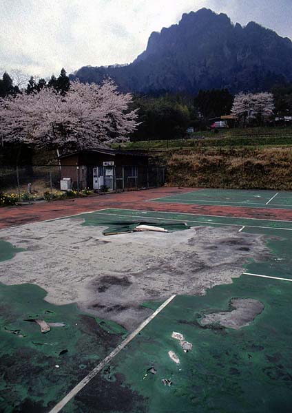 tennis court in disrepair.jpg