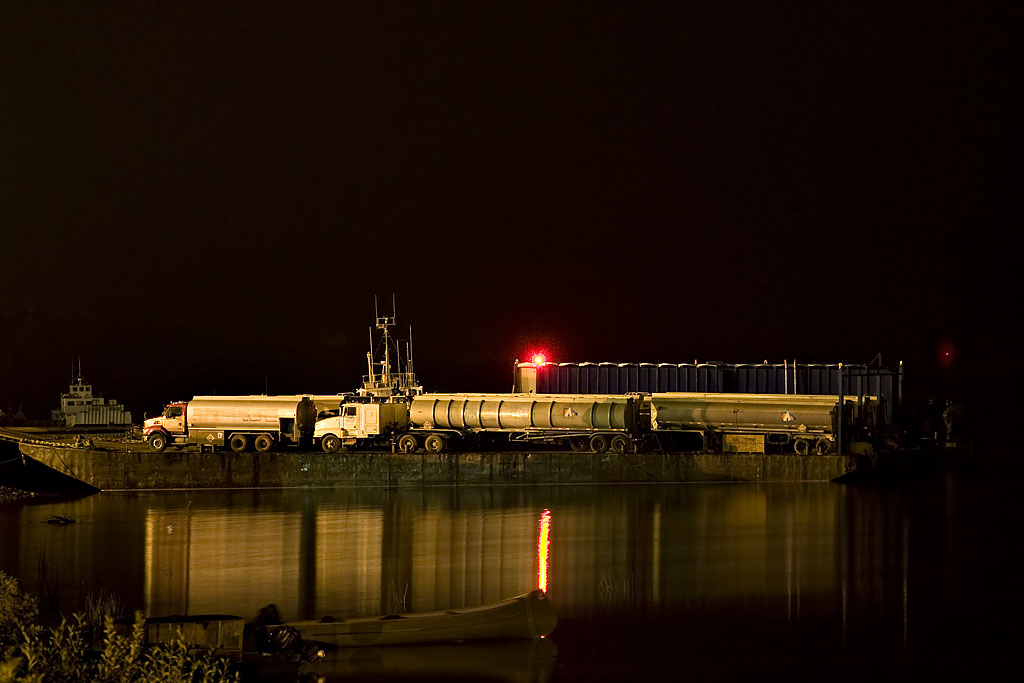 Trucks aboard a barge in Moosonee