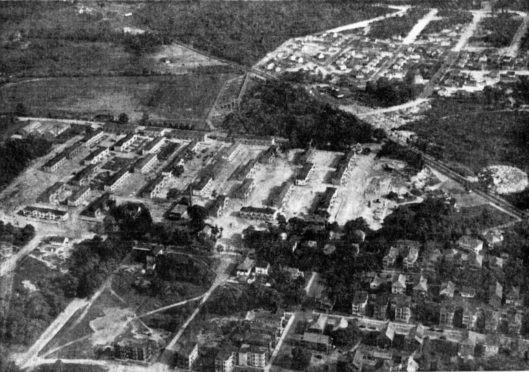 Aerial view of the Stadium and projects, showing land beyond where the theater and bowling alley will be