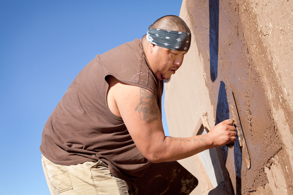 Plastering adobe