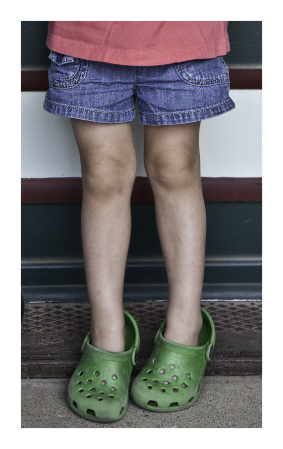 Little girl in moms Crocs
