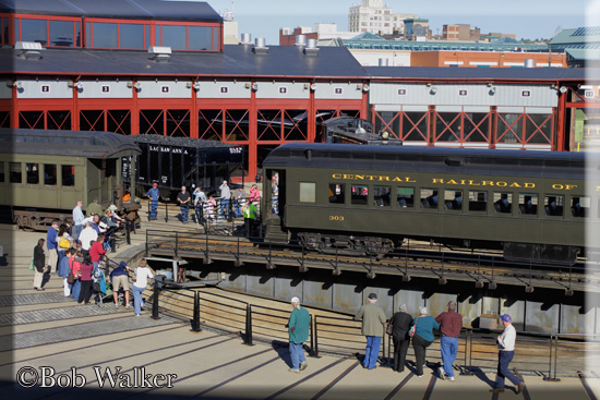 A Crowd Gathers To Watch The Cars On The Turntable