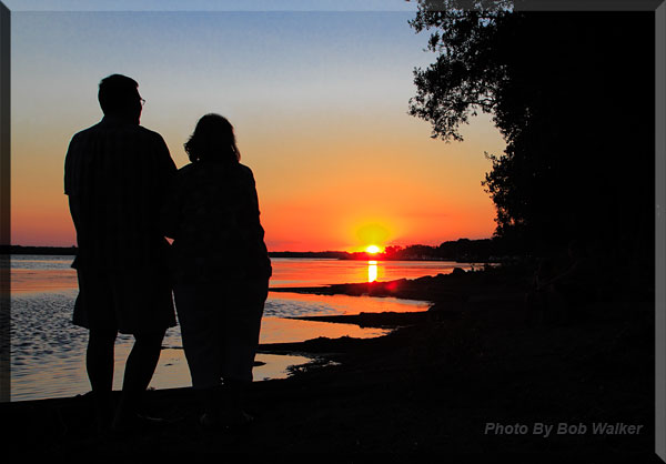 A Couple Enjoy An Evenings Sunset