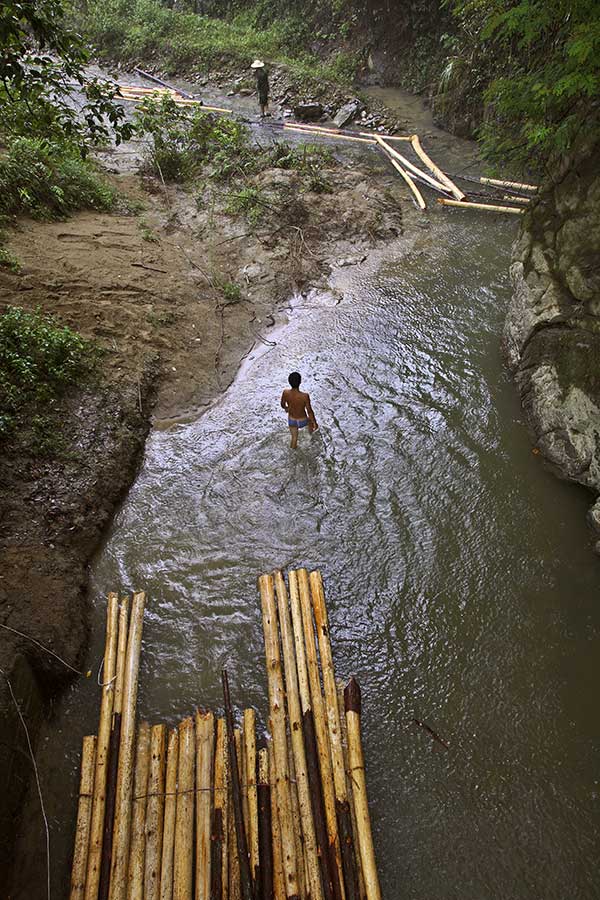 1943 Once a month from spring to fall logs are gathered to be floated to Jinping, which is 15 kms distant. 